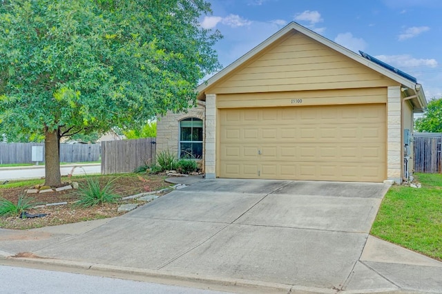 15300 Lucian St, Austin, TX 78725 - view of front of home featuring driveway and a garage