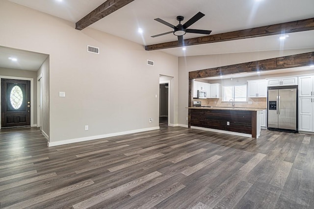 8312 Roan Ln, Austin, TX 78736 - unfurnished living room with beam ceiling, dark wood finished floors, ceiling fan, and recessed lighting