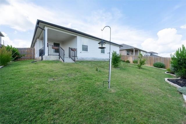 124 Ballyneal Ln, San Marcos, TX 78666 - rear view of house featuring a fenced backyard