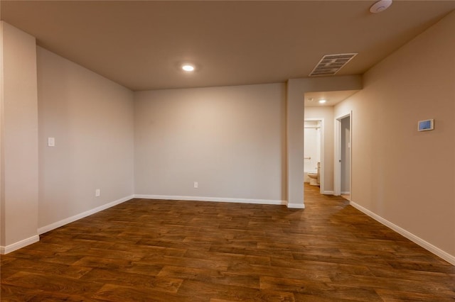 124 Ballyneal Ln, San Marcos, TX 78666 - empty room with dark wood-style floors, recessed lighting, and a smoke detector