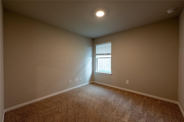124 Ballyneal Ln, San Marcos, TX 78666 - carpeted empty room with baseboards and a smoke detector