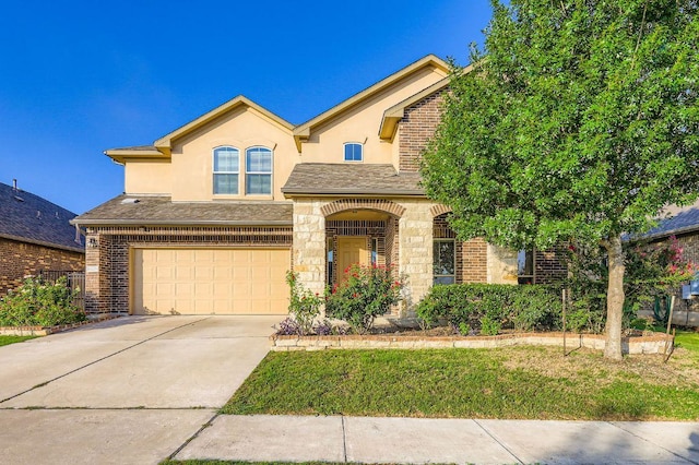 16225 Chianti Cv, Pflugerville, TX 78660 - view of front of home with an attached garage, stucco siding, driveway, and brick siding