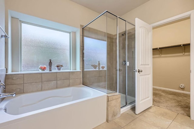 16225 Chianti Cv, Pflugerville, TX 78660 - full bathroom with a bath, a shower stall, tile patterned floors, and a walk in closet