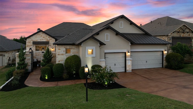 405 Maialina Cv, Lakeway, TX 78738 - french country inspired facade with stone siding, stucco siding, driveway, a front lawn, and an attached garage