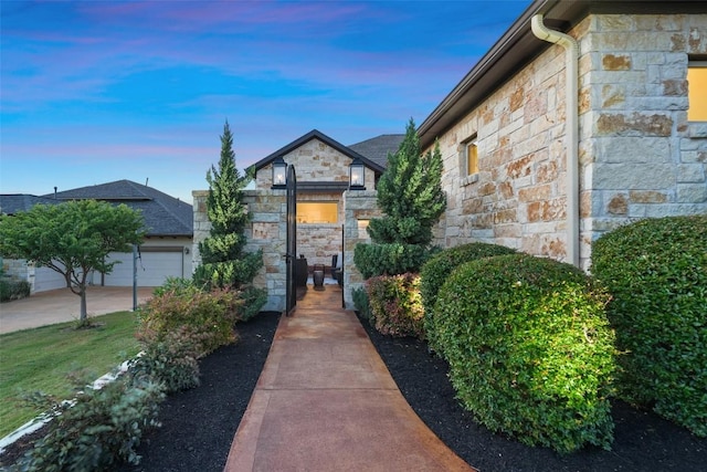405 Maialina Cv, Lakeway, TX 78738 - exterior space with stone siding and a garage