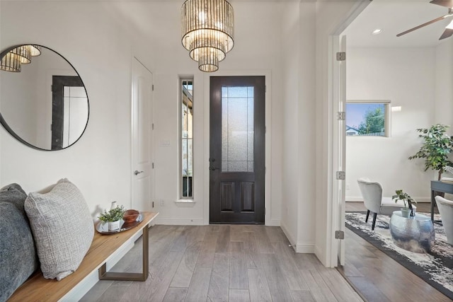 405 Maialina Cv, Lakeway, TX 78738 - foyer featuring a chandelier, wood finished floors, a ceiling fan, and recessed lighting