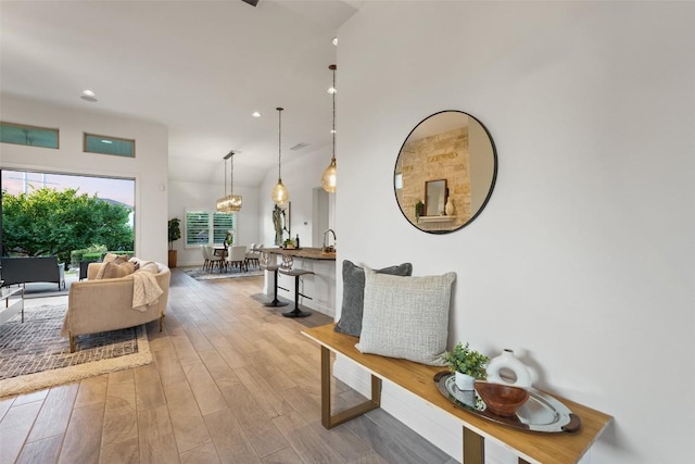 405 Maialina Cv, Lakeway, TX 78738 - corridor with wood finished floors, recessed lighting, and vaulted ceiling