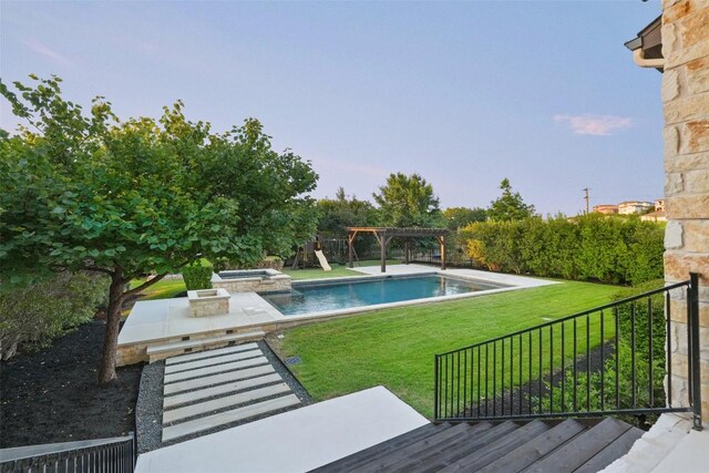 405 Maialina Cv, Lakeway, TX 78738 - view of pool with a pergola, a yard, and a pool with connected hot tub