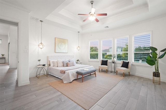 405 Maialina Cv, Lakeway, TX 78738 - bedroom with a tray ceiling, light wood-type flooring, ornamental molding, and ceiling fan