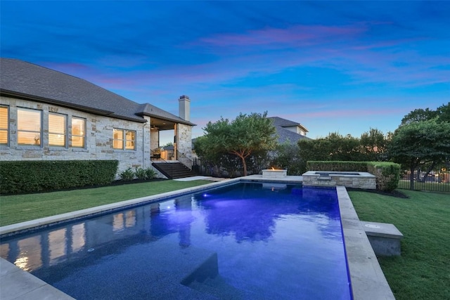 405 Maialina Cv, Lakeway, TX 78738 - pool at dusk featuring a pool with connected hot tub