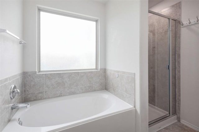 10205 Gertrudis Loop, Austin, TX 78747 - full bathroom with a shower stall and a garden tub