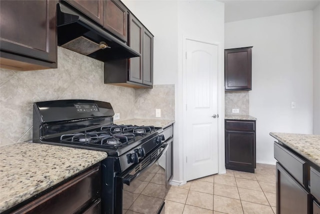 10205 Gertrudis Loop, Austin, TX 78747 - kitchen with black gas stove, under cabinet range hood, dark brown cabinetry, decorative backsplash, and light tile patterned flooring
