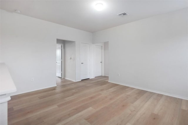10205 Gertrudis Loop, Austin, TX 78747 - unfurnished room with light wood-style floors and a smoke detector