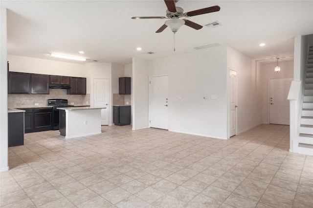 10205 Gertrudis Loop, Austin, TX 78747 - kitchen featuring under cabinet range hood, open floor plan, decorative backsplash, a ceiling fan, and recessed lighting
