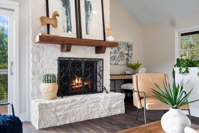 19426 Fisher Ln, Spicewood, TX 78669 - living area with wood finished floors, a lit fireplace, and vaulted ceiling