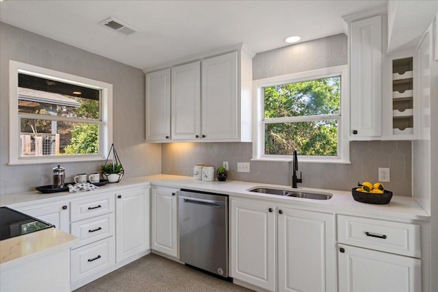 19426 Fisher Ln, Spicewood, TX 78669 - kitchen with dishwasher, white cabinets, light countertops, tasteful backsplash, and healthy amount of natural light