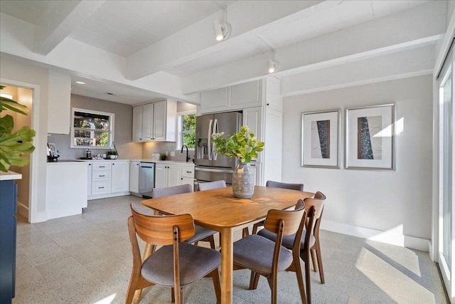 19426 Fisher Ln, Spicewood, TX 78669 - dining area with baseboards and beamed ceiling
