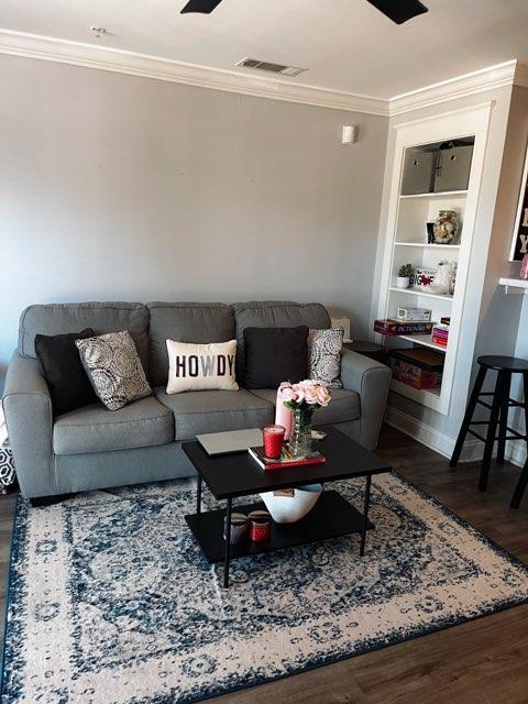 1725 Harvey Mitchell Pkwy S Unit 225, College Station, TX 77840 - living room featuring crown molding, wood finished floors, and built in shelves