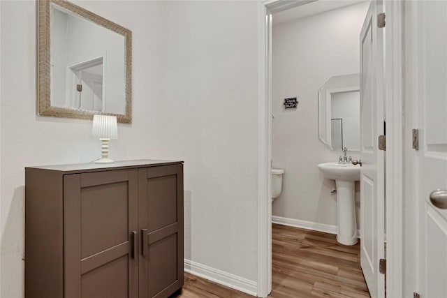 202 Grapefruit Rd, Hutto, TX 78634 - half bath with baseboards and wood finished floors