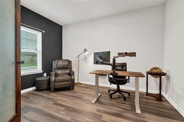 202 Grapefruit Rd, Hutto, TX 78634 - office area with wood finished floors and baseboards