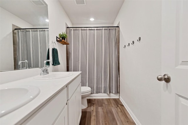 202 Grapefruit Rd, Hutto, TX 78634 - full bath featuring double vanity, wood finished floors, and shower / bathtub combination with curtain