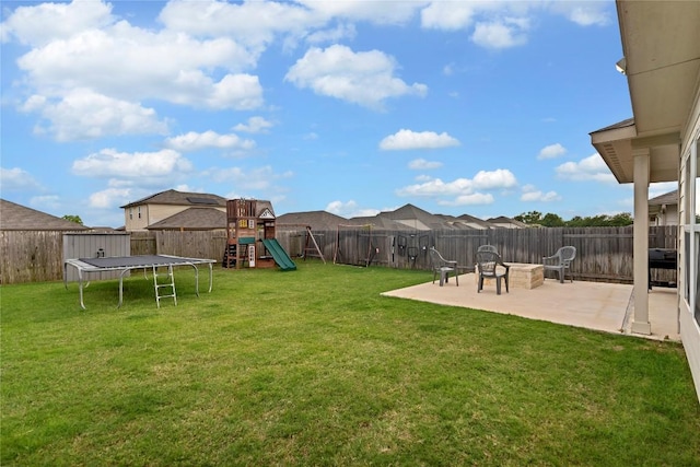 202 Grapefruit Rd, Hutto, TX 78634 - fenced backyard featuring a patio, a trampoline, a playground, and a shed
