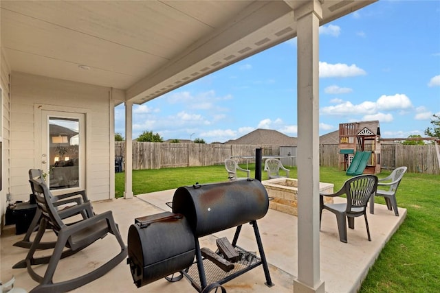 202 Grapefruit Rd, Hutto, TX 78634 - fenced backyard featuring a playground and a patio area