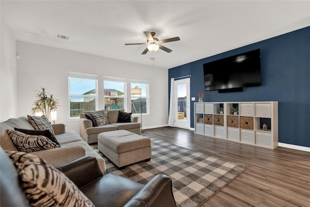 202 Grapefruit Rd, Hutto, TX 78634 - living area with wood finished floors and ceiling fan