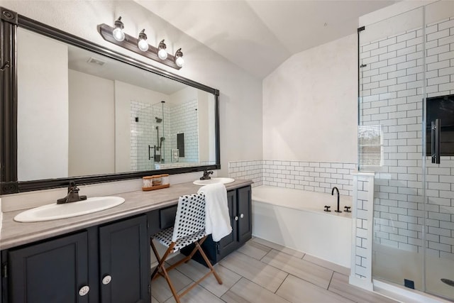 903 Thackeray Ln, Pflugerville, TX 78660 - full bath featuring a stall shower, double vanity, a bath, and lofted ceiling