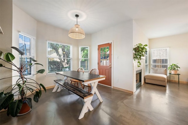 903 Thackeray Ln, Pflugerville, TX 78660 - dining space featuring concrete flooring and a fireplace
