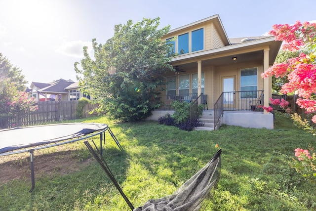 3604 Rosalina Loop, Round Rock, TX 78665 - rear view of property with a trampoline and covered porch