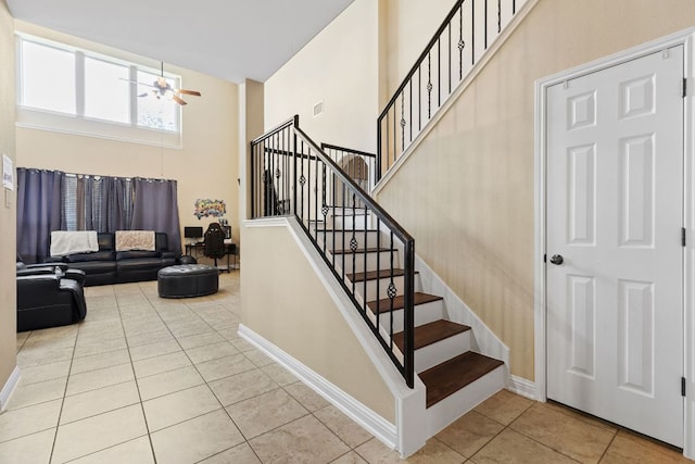 3604 Rosalina Loop, Round Rock, TX 78665 - stairway with ceiling fan, a high ceiling, and tile patterned floors