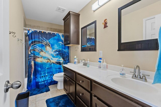 3604 Rosalina Loop, Round Rock, TX 78665 - full bathroom featuring double vanity, tile patterned flooring, and shower / tub combo