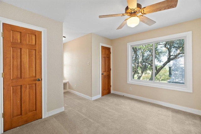 310 County Road 317, Georgetown, TX 78626 - unfurnished bedroom with light colored carpet and a ceiling fan