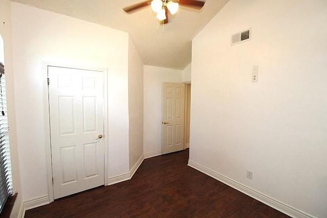 213 Bronc Dr, Copperas Cove, TX 76522 - unfurnished bedroom featuring dark wood-type flooring, lofted ceiling, and a ceiling fan