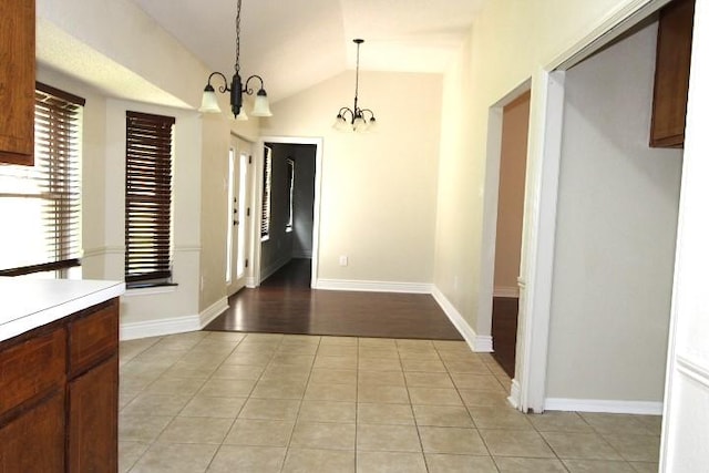 213 Bronc Dr, Copperas Cove, TX 76522 - unfurnished dining area featuring a chandelier, light tile patterned floors, and vaulted ceiling