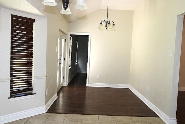 213 Bronc Dr, Copperas Cove, TX 76522 - unfurnished dining area with tile patterned flooring, a chandelier, and lofted ceiling
