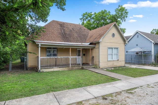 909 W 3rd St, Taylor, TX 76574 - view of front facade featuring a gate, a porch, and a shingled roof