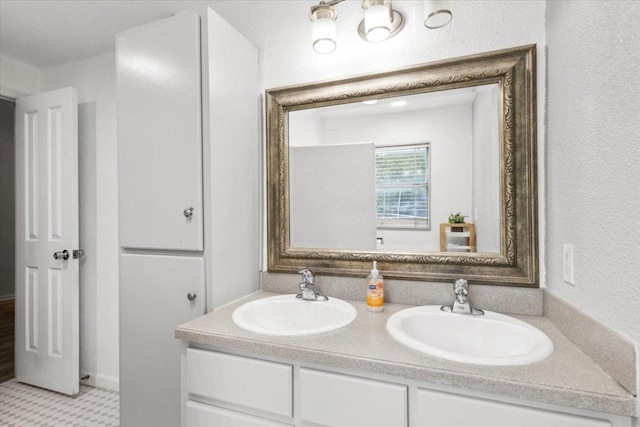 909 W 3rd St, Taylor, TX 76574 - bathroom featuring double vanity