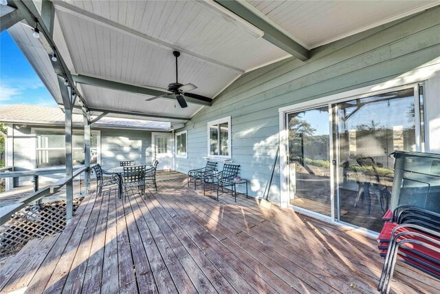 10902 Beach Rd, Leander, TX 78641 - wooden terrace with ceiling fan and outdoor dining area