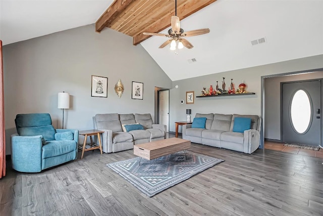 255 Mesquite Dr, Cedar Creek, TX 78612 - living room featuring a ceiling fan, beam ceiling, wood finished floors, and high vaulted ceiling