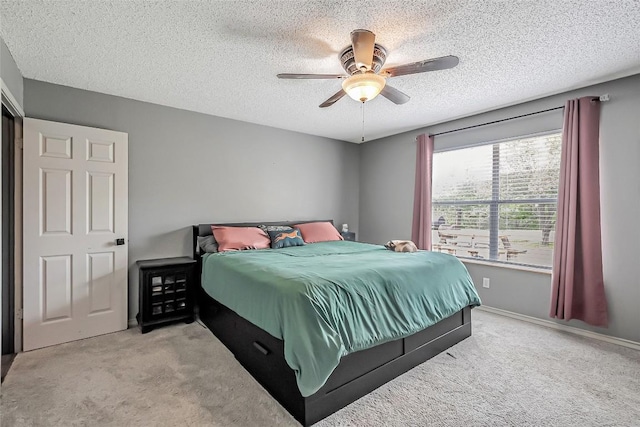 255 Mesquite Dr, Cedar Creek, TX 78612 - bedroom featuring carpet flooring, a textured ceiling, and a ceiling fan