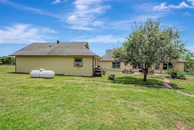 255 Mesquite Dr, Cedar Creek, TX 78612 - back of house with a yard and a patio area