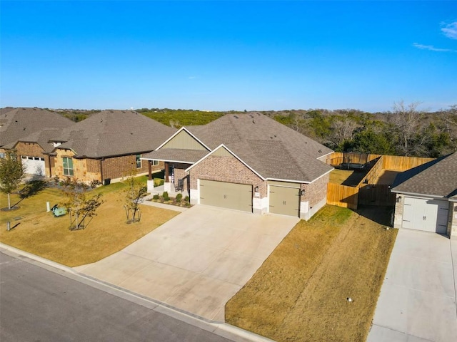 5867 Copano Loop, Belton, TX 76513 - view of front of property featuring an attached garage, concrete driveway, and a gate