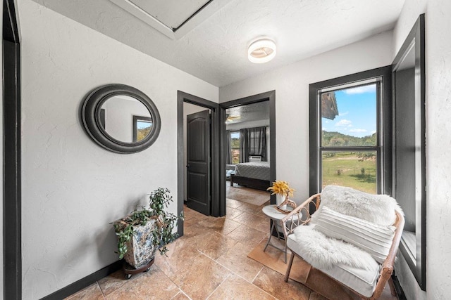 362 Oak Haven Rd, Fredericksburg, TX 78624 - sitting room with stone tile flooring and a textured ceiling