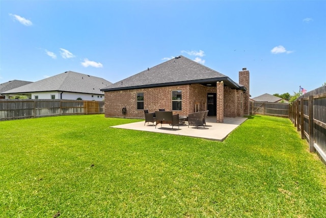 7516 Hardin Dr, Temple, TX 76502 - back of property with a chimney, a fenced backyard, a patio area, brick siding, and roof with shingles