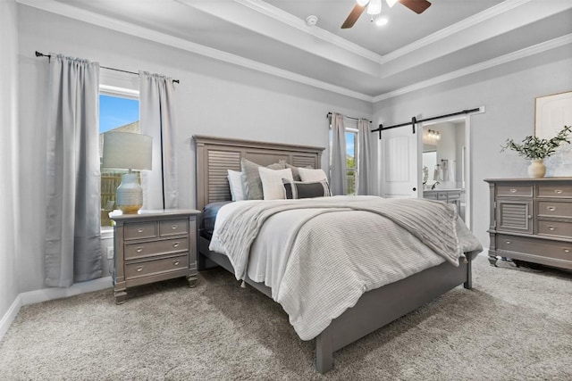 7516 Hardin Dr, Temple, TX 76502 - carpeted bedroom with ornamental molding, a barn door, a tray ceiling, ceiling fan, and connected bathroom