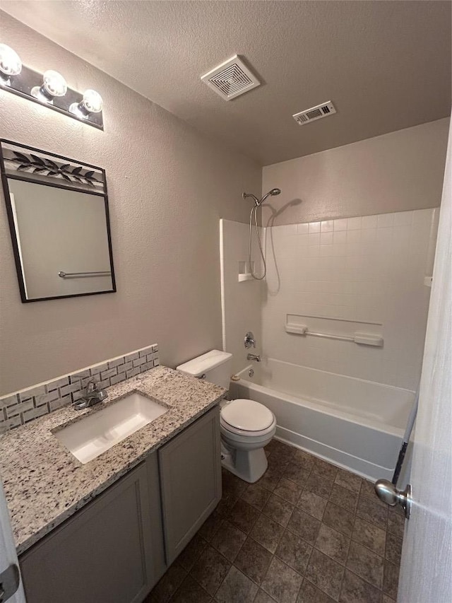 2101 Whistling Way, Taylor, TX 76574 - full bathroom with vanity, bathing tub / shower combination, and a textured ceiling