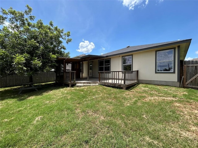 2101 Whistling Way, Taylor, TX 76574 - back of property with a wooden deck