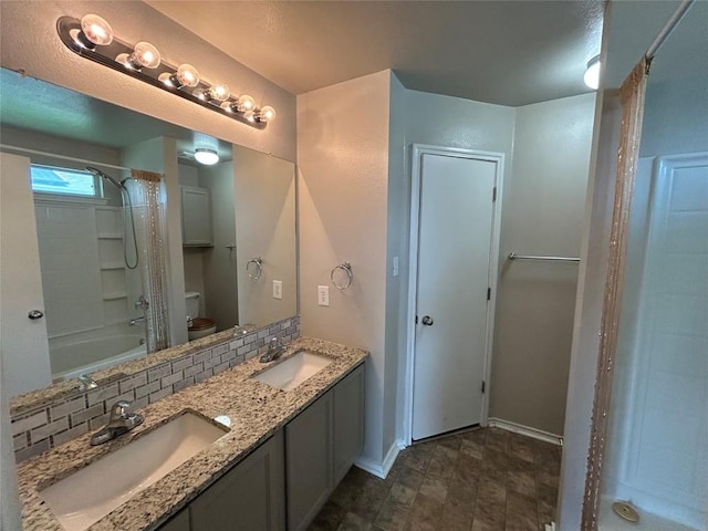 2101 Whistling Way, Taylor, TX 76574 - full bathroom featuring double vanity and shower / bath combo